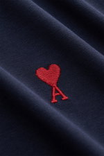 Close-up front view of Ami Paris Crew Neck T-Shirt Navy showing red heart stitching on navy pure cotton jersey fabric with soft feel.