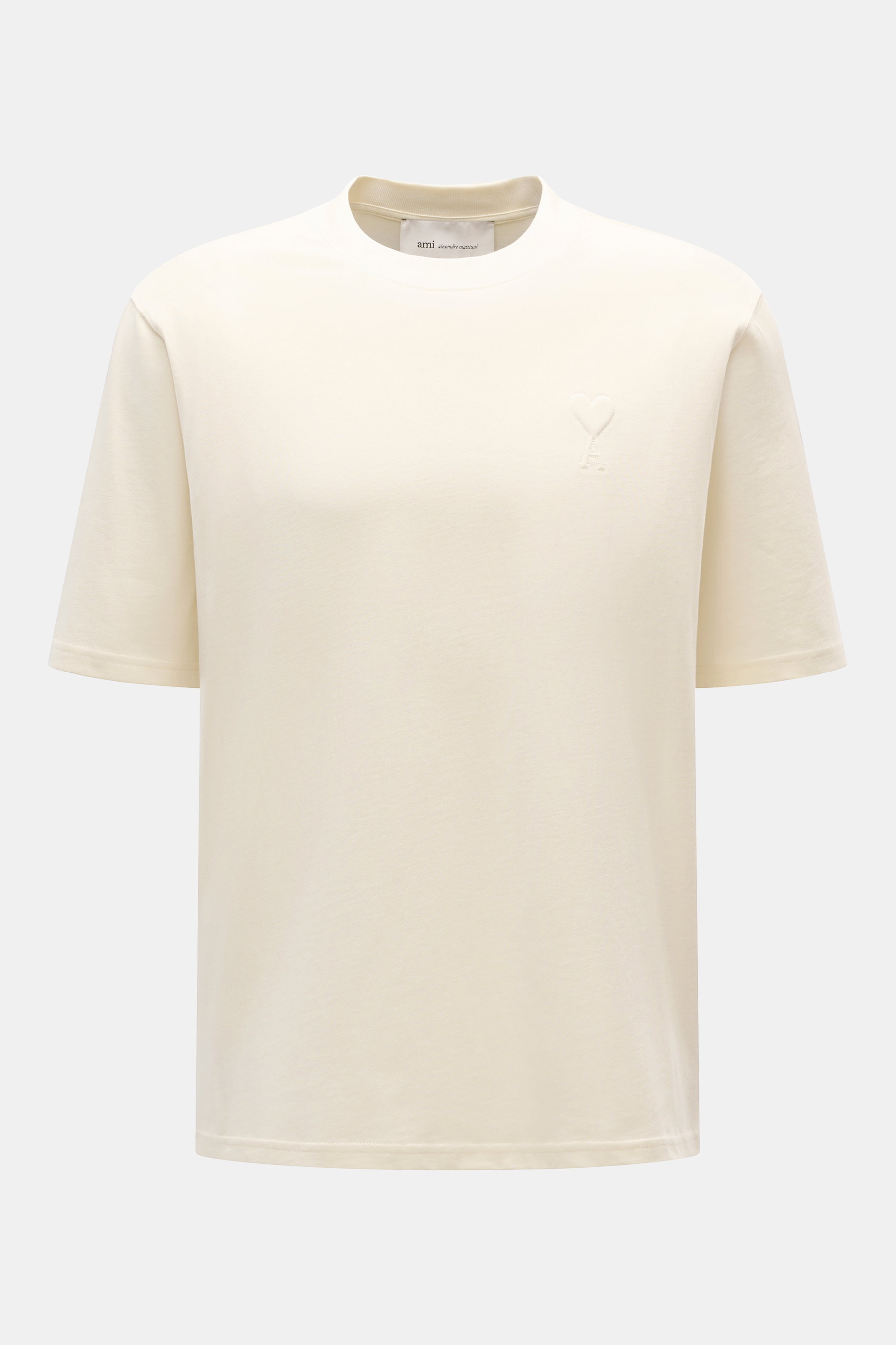 Ami Paris Rundhals-T-Shirt creme, frontal fotografiert, Oversized Fit, Jersey aus Baumwolle, abgesteppter Herz-Logo-Print, Rundhalsausschnitt.