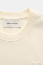 Ami Paris Crew neck T-shirt cream shown from a close-up front top view, featuring a ribbed crew neck and label.