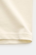 Close-up front view of Ami Paris Crew neck T-shirt cream showing soft, heavy cotton jersey fabric and neat stitching.

Description: <p>Pardon my French – with this T-shirt by AMI PARIS you’ll get by even without good language skills, because the quilted h