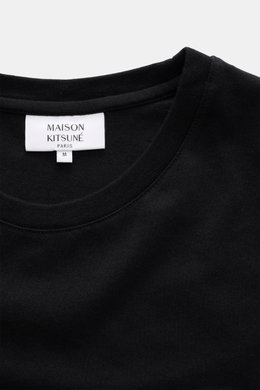 Maison Kitsuné Crew Neck T-Shirt 'Fox Head' black shown from a close-up top perspective, featuring a soft, pure cotton jersey with a crew neckline. 

<p>Sporty essential from MAISON KITSUNÉ: With the typical fox patch on the chest, this shirt will be a fa