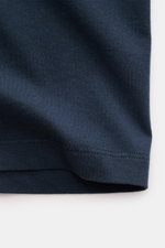 Close-up view of navy blue fabric and stitching detail of the Maison Kitsuné Crew Neck T-Shirt 'Fox Head' navy, showing soft cotton jersey texture.

<p>Sporty essential from MAISON KITSUNÉ: With the typical fox patch on the chest, this shirt will be a fav