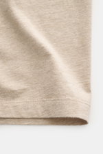 Close-up shot of beige melange fabric and stitching detail of the Maison Kitsuné Crew Neck T-Shirt 'Fox Head' showing soft pure cotton jersey material.

<p>Sporty essential from MAISON KITSUNÉ: With the typical fox patch on the chest, this shirt will be a
