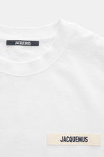 Close-up front view of Jacquemus Crew Neck T-Shirt white, featuring pure cotton, soft touch, slim fit, and grosgrain with logo stitching on chest.
