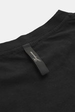 Close-up view of the neckline of the Jacquemus Crew neck T-Shirt black, showing pure cotton fabric, soft touch, slim fit, and logo print on the front.