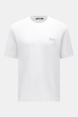 Front view of Jacquemus Crew neck T-shirt 'Le Montaigne MC' white, slim fit jersey made of pure cotton with soft touch, fine diagonal texture, crew neckline, woven label on chest, side hem slits, and extended back.