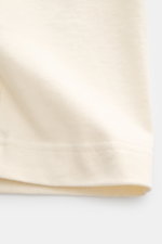 Close-up front view of Jacquemus Crew Neck T-Shirt cream showing pure cotton fabric with soft touch, slim fit, and grosgrain logo stitching and print on the chest.