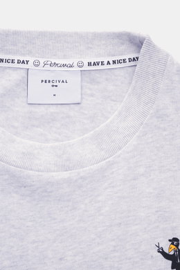 Close-up front view of the Percival T-Shirt grey melange showing round neckline, logo print on chest, pure cotton, soft touch.

<p>Casual through the transitional period: The T-shirt from PERCIVAL sets a relaxed street style accent with its striking back 