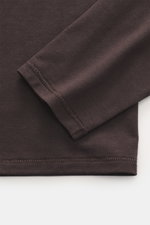 Close-up front view of the sleeve and hem of the Kiefermann Crew neck long sleeve 'Emil' dark brown shirt, showing jersey in modal and cotton, elasticated fabric, soft touch, slim fit, crew neck.