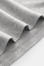 Close-up angled view of the Kiefermann Crew neck long sleeve 'Alberts' grey melange showing soft, elasticated jersey fabric in modal and cotton with slim fit, crew neck.