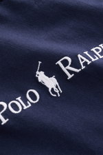 Close-up front view of Polo Ralph Lauren Crew neck T-shirt navy showing white embroidered signature logo on navy pure cotton fabric.

<p>A timeless classic for hot days: This T-shirt by POLO RALPH LAUREN features a signature logo and a casual boxy fit tha