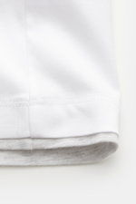 Close-up side view of the Brunello Cucinelli Crew neck T-shirt white/light grey melange showing soft cotton fabric and contrasting double hem.

<p>BRUNELLO CUCINELLI delivers an essential basic for your casual wardrobe with this relaxed T-shirt in comfort