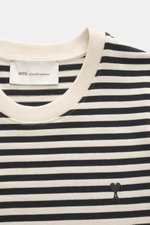 Ami Paris Longsleeve black/cream striped shown from a top-front close-up perspective, featuring a round neckline and embroidered heart logo on the chest, made of pure cotton with a slightly textured feel, heavy quality, slim fit, and back AMI stitching. 
