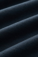 Close-up fabric texture of the 04651/ A trip in a bag Longsleeve 'Jersey Tee' navy, showing soft, lightweight cotton jersey from a top-down perspective.