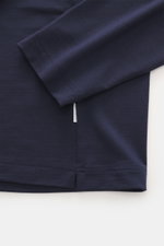 Close-up front view of the navy 04651/ A trip in a bag Longsleeve 'WJ Tee' showing soft wool-microfiber fabric, round neckline, regular fit, and short hem slits. Versatile basic: The soft longsleeve 'WJ Tee' from 04651/ A TRIP IN A BAG combines the highes