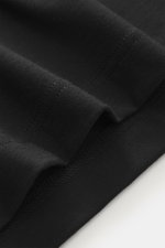 Close-up front view of the black 04651/ A trip in a bag Longsleeve 'WJ Tee' showing soft fabric texture and stitching details.

<p>Versatile basic: The soft longsleeve 'WJ Tee' by 04651/ A TRIP IN A BAG combines the highest material quality with great wea