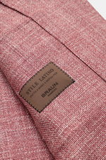 Close-up angled view of Stile Latino Overshirt 'Gu Texas' dunkelrot/offwhite meliert fabric texture and brown stitched label by Braun Hamburg, showcasing luxurious layering essential with wool, silk, and linen mix, regular fit, five-button placket, spread
