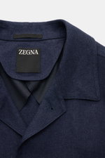 Close-up front view of the Zegna Overshirt navy collar and label showing fine twill fabric in a linen and wool blend.

<p>This overshirt by ZEGNA, made from linen and wool, embodies Italian casual style with its pleasantly soft feel and denim look – a mus