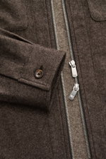 Close-up front view of Marco Pescarolo Overshirt 'Urus' brown melange showing two-way zipper, patch chest pocket with flap, button cuff, and fine woven texture. MARCO PESCAROLO impresses with the traditionally Italian-made overshirt 'Urus', naturally comb