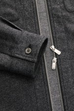 Close-up front view of Marco Pescarolo Overshirt 'Urus' dark grey melange, showing two-way zipper, patch chest pockets, and buttoned cuff.

Description: <p>MARCO PESCAROLO impresses with the traditionally Italian-made overshirt 'Urus', naturally combining