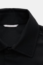 Close-up front view of the Marco Pescarolo Overshirt 'Zenith' black showing the turn-down collar and textured fabric.

<p>Timeless fall essential: The 'Zenith' overshirt by MARCO PESCAROLO impresses with minimalist elegance and versatile wearability. As a