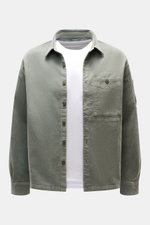 Front view of C.P. Company Cord Overshirt Grey Green in slim fit, soft elastic cotton corduroy with chest and upper arm pockets.

Description: <p>Casualwear with character: The Cord Overshirt from C.P. COMPANY impresses with soft cotton quality, distincti
