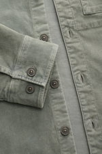 Close-up front detail of C.P. Company Cord Overshirt Grey Green, showing slim fit corduroy fabric, six-button placket, cuffed sleeve, and chest pocket.

Description: <p>Casualwear with character: The Cord Overshirt from C.P. COMPANY impresses with soft co