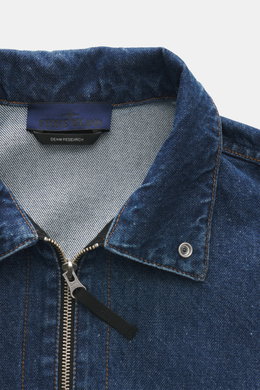Stone Island Blue denim jacket photographed from front top view, slim fit, denim made of pure cotton, typical material texture, two-way zipper, turn-down collar, patch chest pocket, compass badge on upper arm.