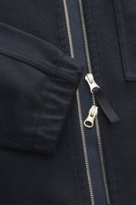 Close-up front view of the Stone Island Overshirt navy showing a high-closing two-way zipper, elastic cuff, patch chest pocket with flap, and typical compass badge; made from a mix of virgin wool and high-quality microfiber, featuring firm, felted quality
