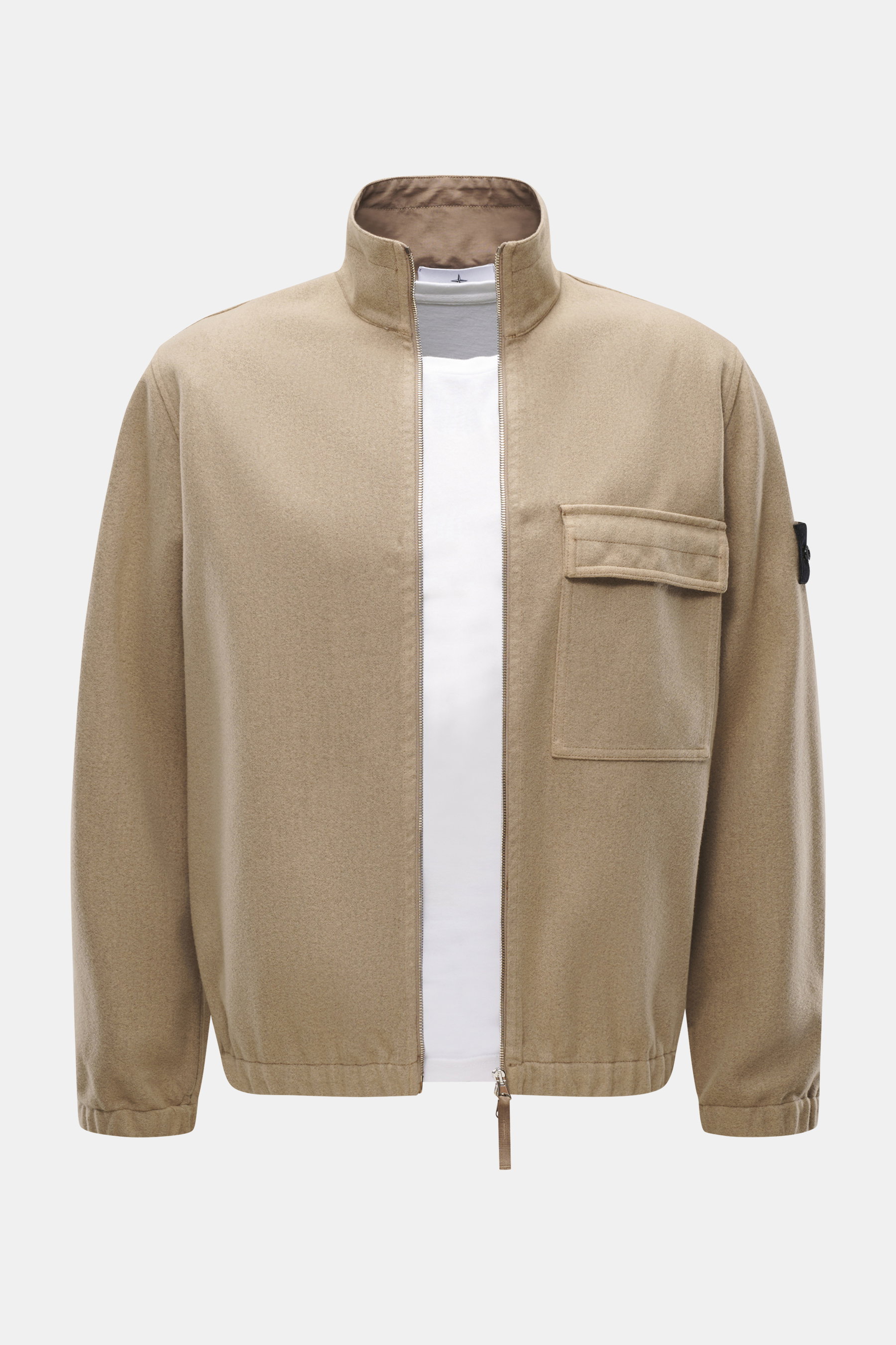 Front view of Stone Island Overshirt beige, slim fit with mix of virgin wool and microfiber, garment dyed, firm felted quality, high-closing two-way zipper, patch chest pocket with flap, typical compass badge on sleeve, elastic cuffs, and unlined.