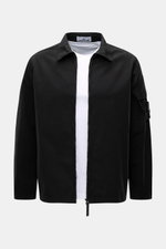 Stone Island Overshirt 'Canvas' black shown from the front, featuring a turn-down collar, robust two-way zipper, patch pocket with flap on sleeve, adjustable snap button cuffs, and the typical compass badge; made of pure organic cotton canvas, garment dye