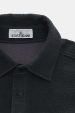Close-up front view of Stone Island Overshirt navy collar and top button, showing textured bouclé wool and microfiber mix fabric.

Description:  
<p>Timeless layering essential: The bouclé overshirt from STONE ISLAND complements autumn and winter looks wi