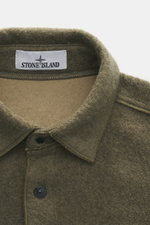 Stone Island Overshirt olive close-up from above showing textured wool-microfiber mix, turn-down collar, and button placket.