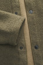 Close-up front view of Stone Island Overshirt olive in boucle fabric with five-button placket and textured wool-microfiber mix.

Description: <p>Timeless layering essential: The boucle overshirt from STONE ISLAND complements autumn and winter looks with c