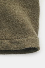 Close-up detail of the slightly textured wool and microfiber fabric of the Stone Island Overshirt olive, photographed from a top-down angle.

Additional description: 
<p>Timeless layering essential: The boucle overshirt from STONE ISLAND complements autum