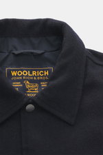 Close-up front view of Woolrich Down jacket navy melange showing wool and microfiber fabric, light down filling, slim fit, snap button placket, adjustable collar with button tab, slanted welt pockets, cuff sleeves with cuffs, adjustable waist width, quilt