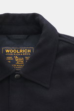 Close-up front view of Woolrich Down jacket 'Alaskan' navy melange collar, showing wool and microfiber, light down filling, slim fit, snap button placket, adjustable collar with button tab, patch chest pockets, slanted welt pockets, sleeve cuffs with cuff