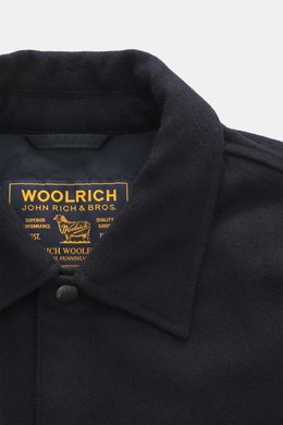 Close-up front view of Woolrich Down jacket 'Alaskan' navy melange collar, showing wool and microfiber, light down filling, slim fit, snap button placket, adjustable collar with button tab, patch chest pockets, slanted welt pockets, sleeve cuffs with cuff