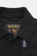Woolrich Down jacket 'Alaskan' black melange close-up front view showing wool and microfiber fabric, slim fit, snap button placket, adjustable collar with button tab, patch chest pockets, slanted welt pockets, sleeve cuffs with cuff, light down filling, q