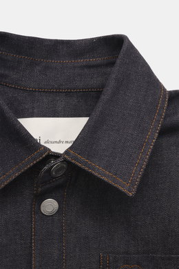 Close-up front view of Ami Paris Denim overshirt navy showing pure cotton, textured feel, heavy quality, oversized fit, snap button placket, turn-down collar, patch chest pocket with logo stitching, cuffed sleeve ends, unlined.