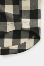 Close-up front view of Ami Paris Overshirt black/cream checkered showing the rounded hemline and patch pocket flap details.

Description: Casual through the transitional season: The overshirt by AMI PARIS impresses with a loose fit made of pure wool in a 