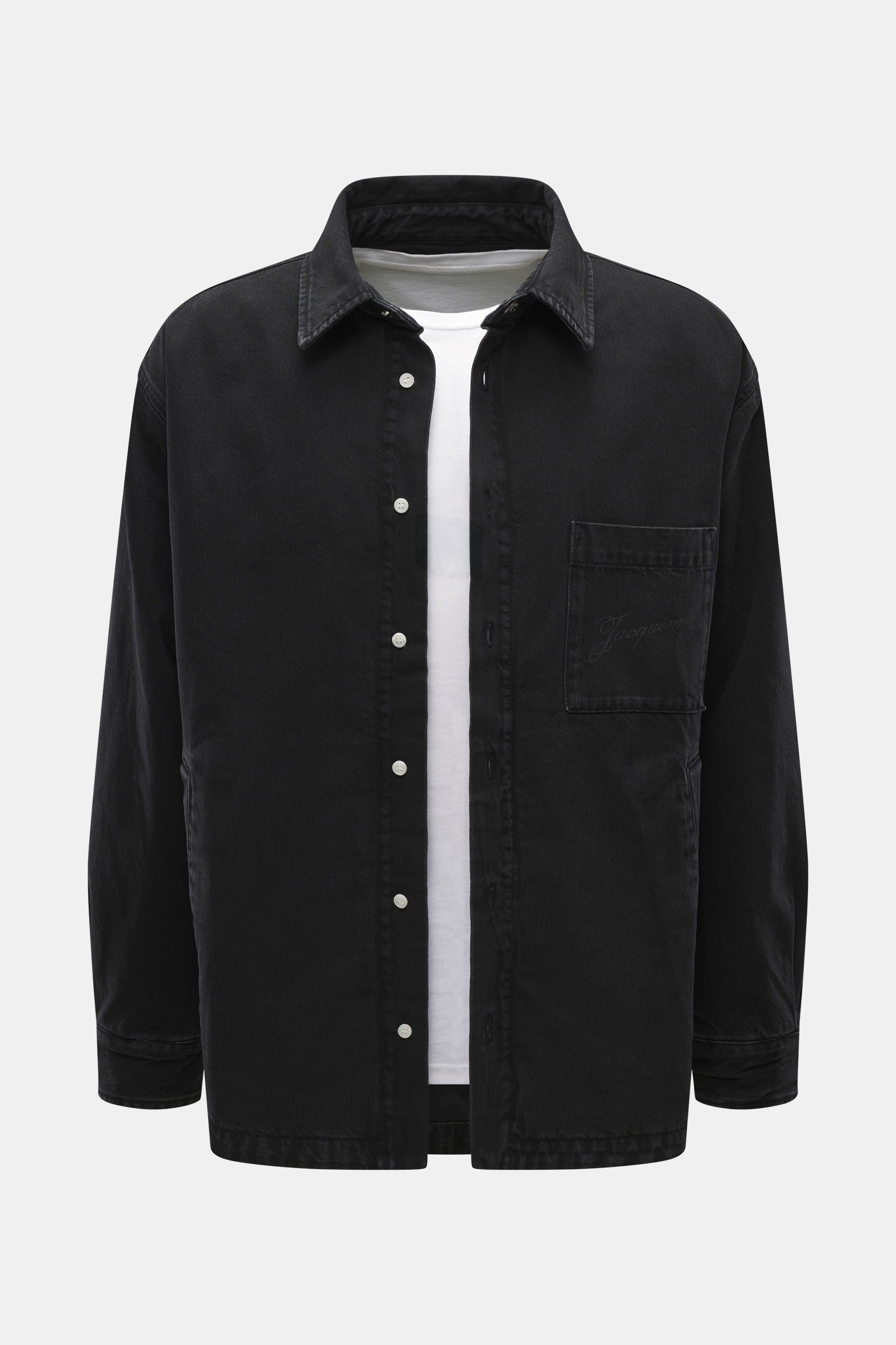 Front view of Jacquemus Overshirt black made from pure cotton denim, soft touch, oversized fit with turn-down collar, smooth button placket, welted front pockets, chest pocket with logo print, decorative J-hook, classic sport cuff, and rounded hem.