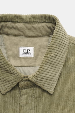 Close-up front view of the C.P. Company Cord overshirt sand, showcasing its corduroy pure cotton fabric, velvety texture, and turn-down collar.