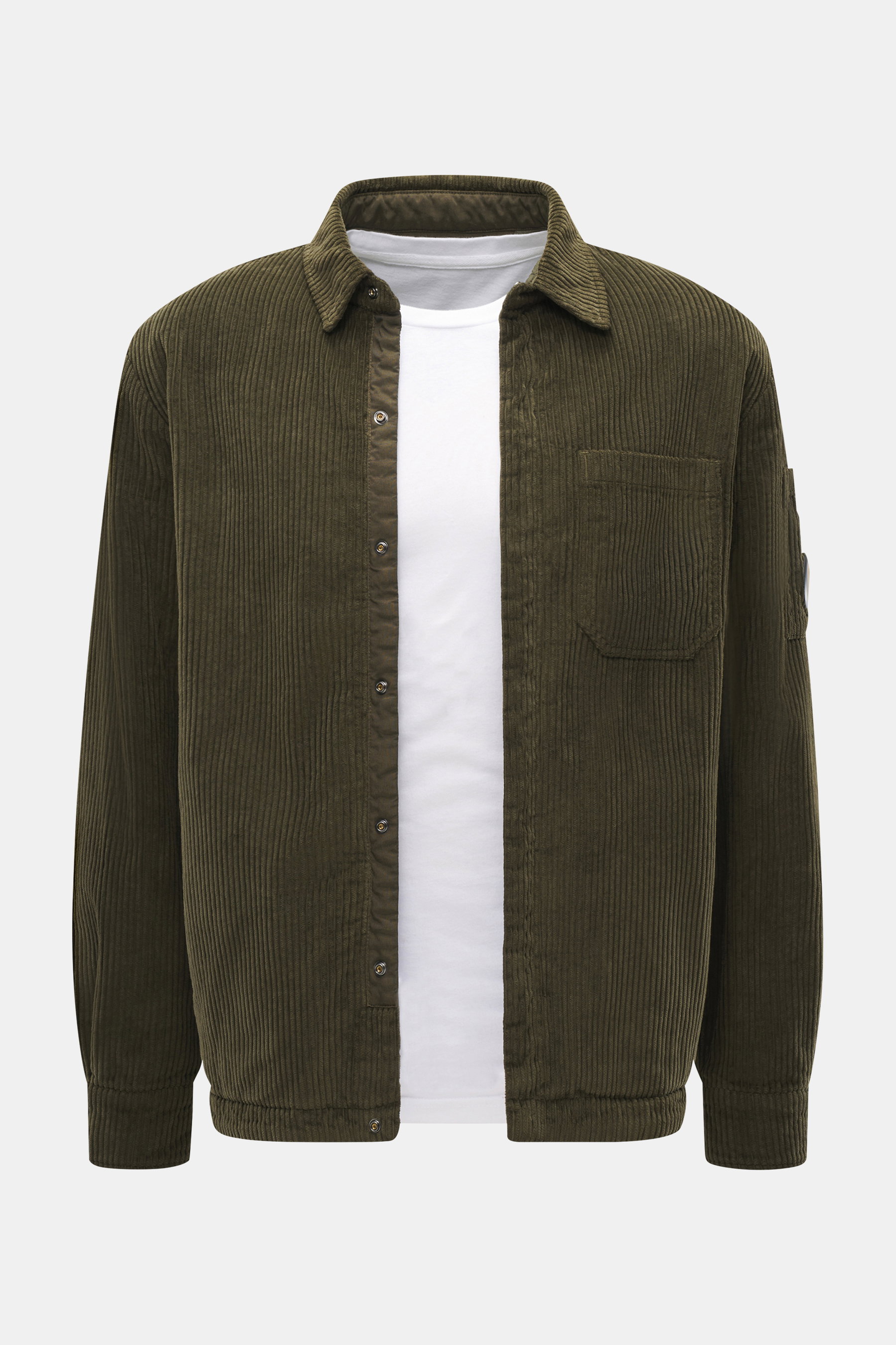 C.P. Company Corduroy Overshirt khaki shown from the front, casual cotton corduroy with velvety feel, slim fit, snap buttons, turn-down collar, chest pocket, cuff sleeves, upper arm snap pocket, and lens detail.