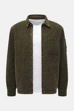 C.P. Company Corduroy Overshirt khaki shown from the front, casual cotton corduroy with velvety feel, slim fit, snap buttons, turn-down collar, chest pocket, cuff sleeves, upper arm snap pocket, and lens detail.