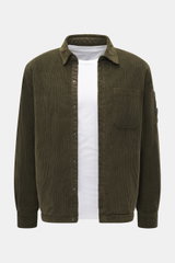 C.P. Company Corduroy Overshirt khaki shown from the front, casual cotton corduroy with velvety feel, slim fit, snap buttons, turn-down collar, chest pocket, cuff sleeves, upper arm snap pocket, and lens detail.