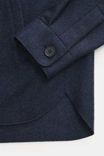 Harris Wharf London Cashmere overshirt navy melange close-up from above showing pure cashmere fabric with knitted and felted quality, very soft touch, raw-edge finish, slim fit, five-button placket, turn-down collar, patch chest pockets with flap, angled 