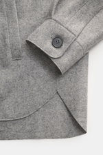 Harris Wharf London Cashmere overshirt grey melange shown from above, featuring pure cashmere, knitted and felted quality, very soft touch, raw-edge finish, slim fit, five-button placket, turn-down collar, patch chest pockets with flap, angled welt pocket
