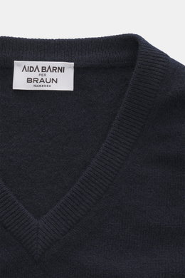 Close-up top view of the Aida Barni Cashmere V-neck jumper navy showcasing fine knit, ribbed cuffs, and label detail.
