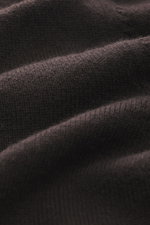 Close-up front view of Aida Barni Cashmere V-neck jumper dark brown, showing pure cashmere fabric with fine knit, soft feel, regular fit, V-neck, and ribbed cuffs.